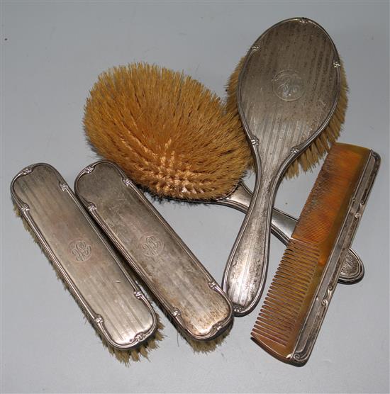 Set of silver toilet brushes